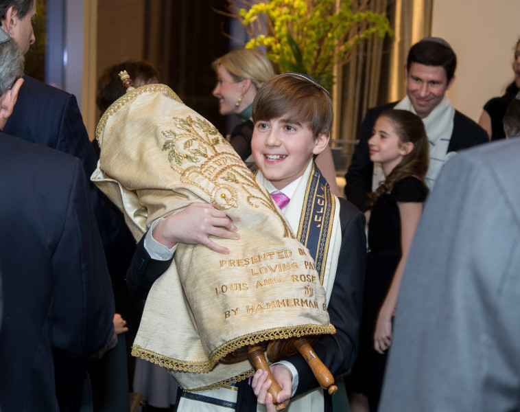 Ben Asen Celebration Photo: Bar Mitzvah boy holding the torah