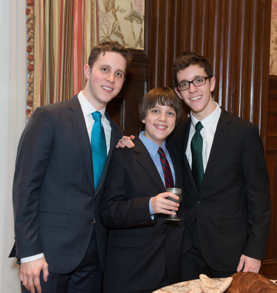 Ben Asen Celebration Photo: Bar Mitzvah boy with his 2 brothers with kiddush wine cup and challah
