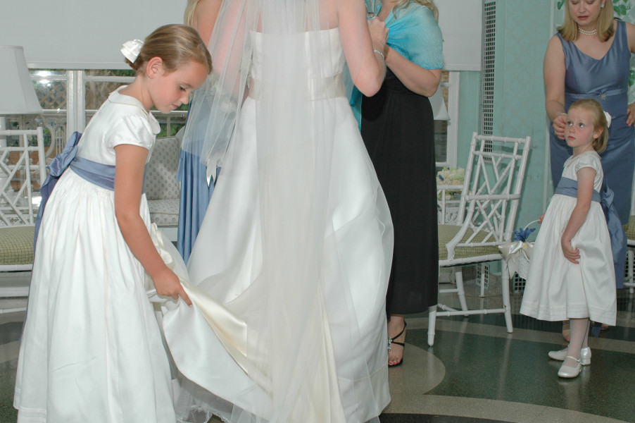 Ben Asen Celebrations Photo: Bride getting ready for wedding ceremony with flower girls