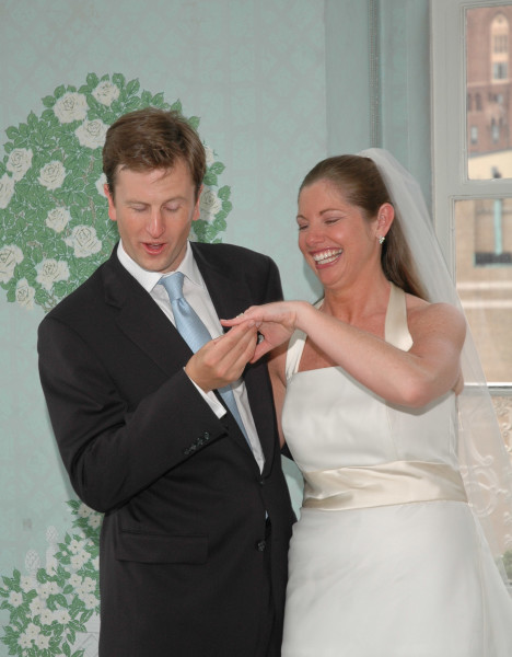 Ben Asen Celebrations Photo: Groom looking at brides ring