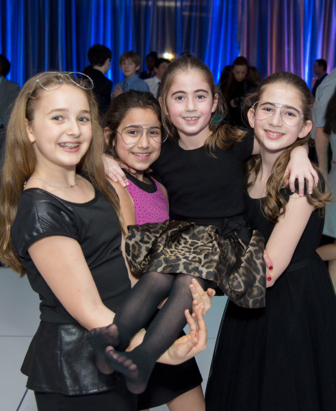 Ben Asen Celebration Photo: 3 girls holding up the sister of a bar mitzvah boy at the bar mitzvah party
