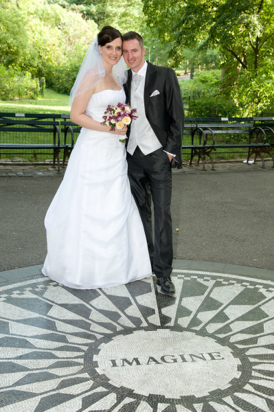 Ben Asen Celebrations Photo: Bride and groom standing in Strawberry Fields on the John Lennon Imagine Memorial in New York City Central Park for a wedding