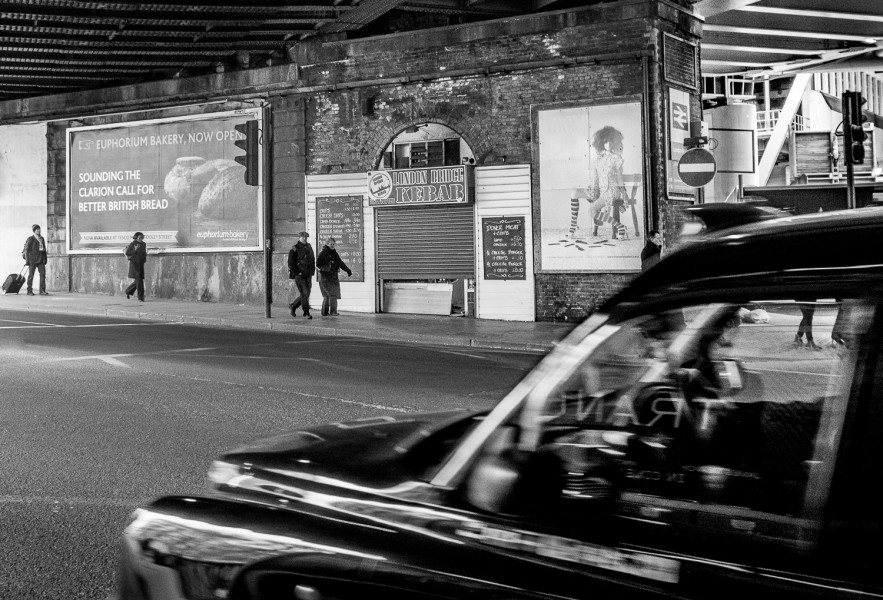 Ben Asen Personal Work Photo: black and white photo of people walking London England with black car in the foreground