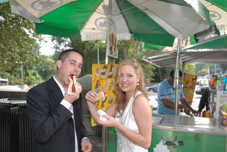 Ben Asen Celebration Photo: Bride and groom eating a hotdog in Central Park New York City